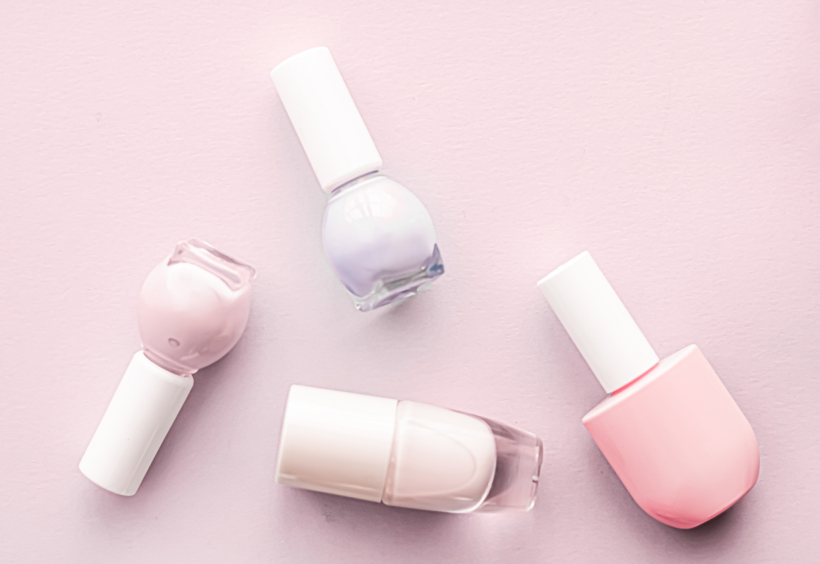 Nail Polish Bottles on Blush Pink Background, Beauty Brand